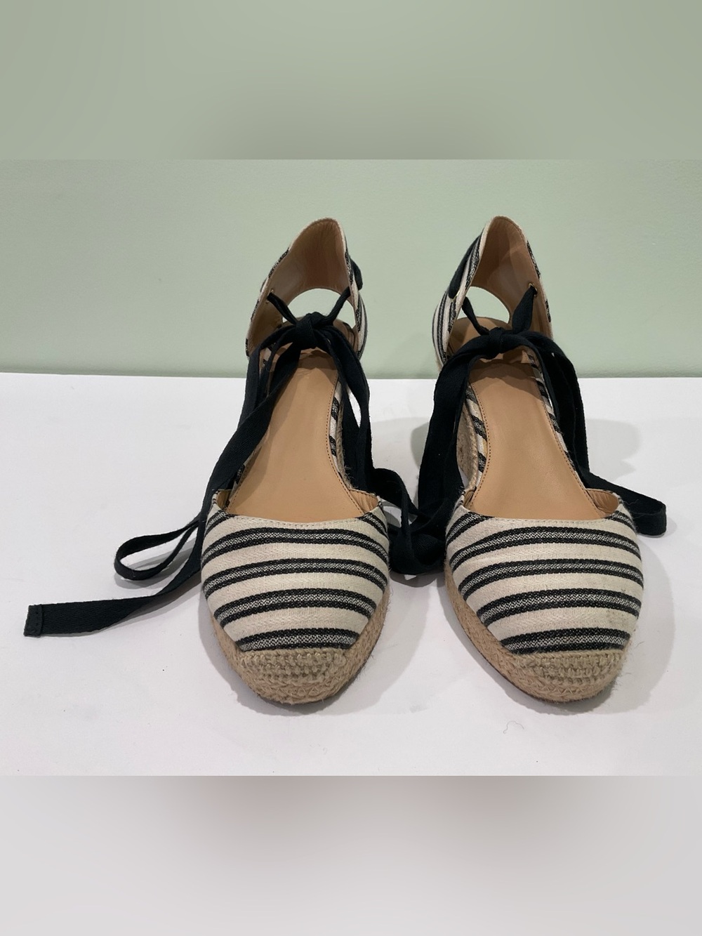 These appear to be J.Crew black and white striped espadrille wedge sandals featu